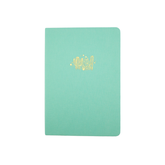 The A5 bobo Lined Journal "Pencil Garden" with a light mint green linen cover. A gold foil illustration of cactus and pencils is stamped onto the front cover. 