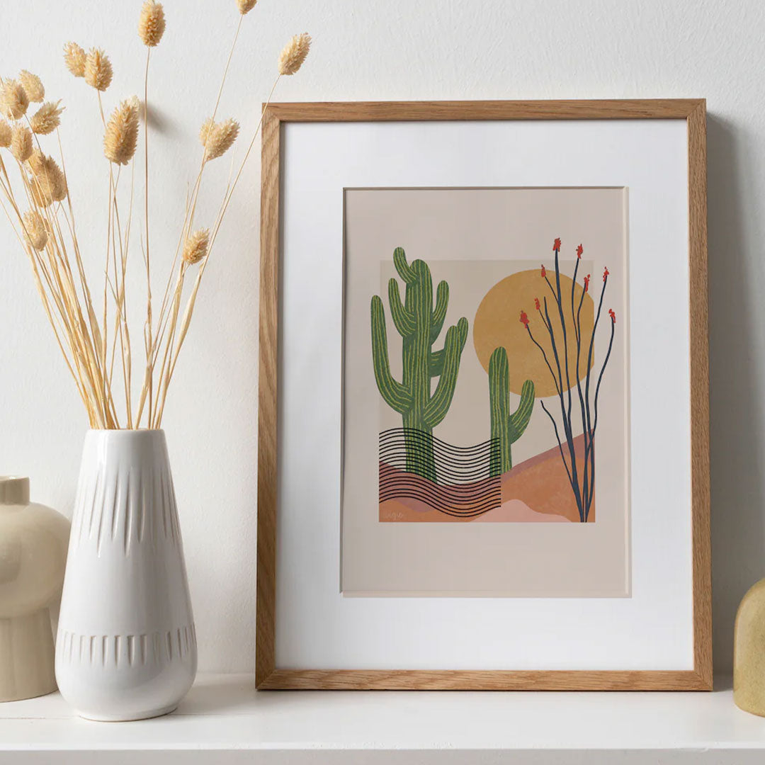 saguaro and ocotillo print with two saguaro cactus, an ocotillo plant, and a sun. with a modern art style