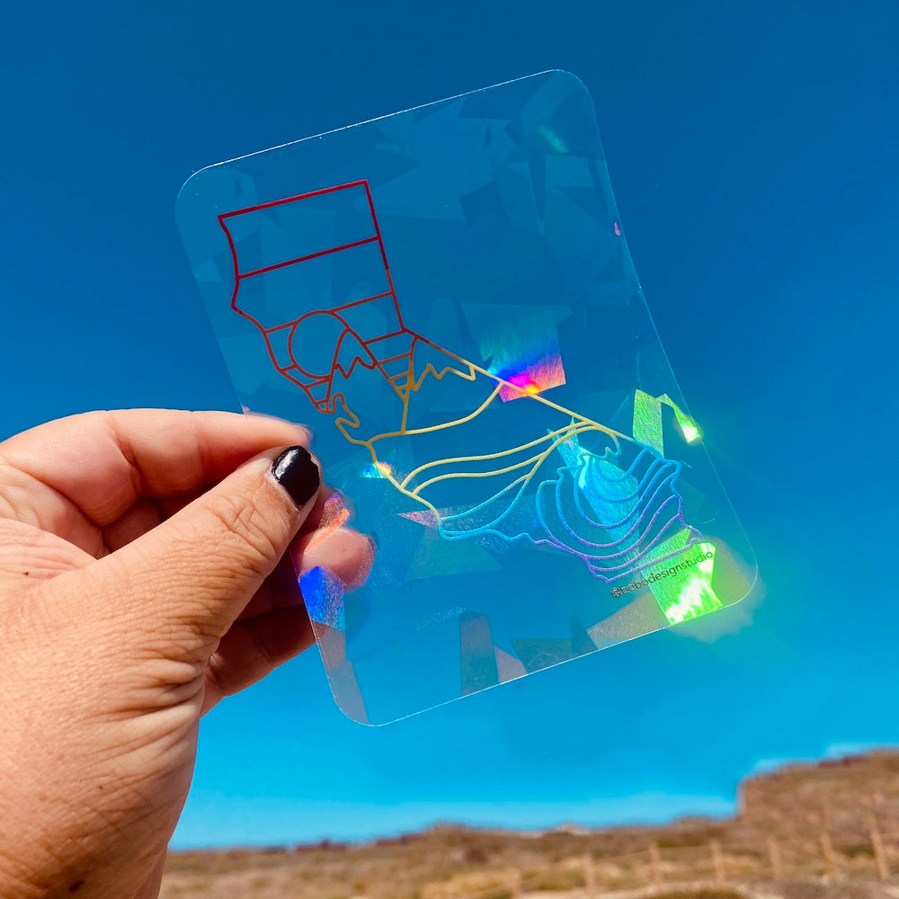 hand holding up california sun catcher to the sky