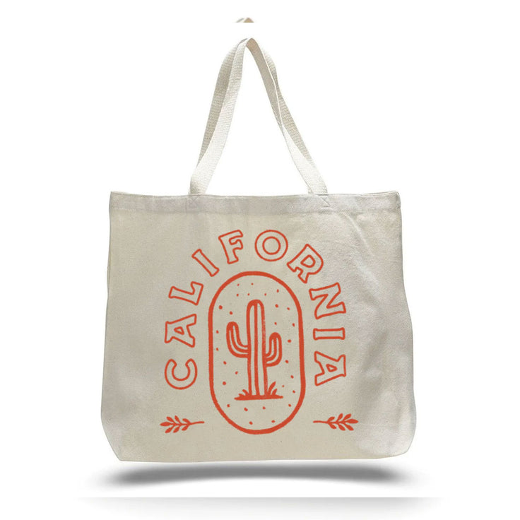 white cream colored tote bag with a orange cactus print and the word California in orange writing wrapped around the cactus