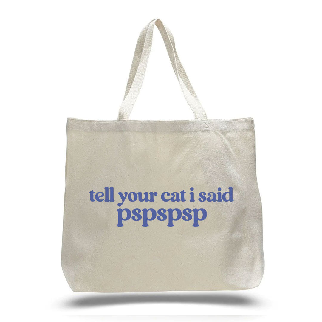 cream white canvas tote bag with " tell your cat i said pspspspsp" in blue lettering 