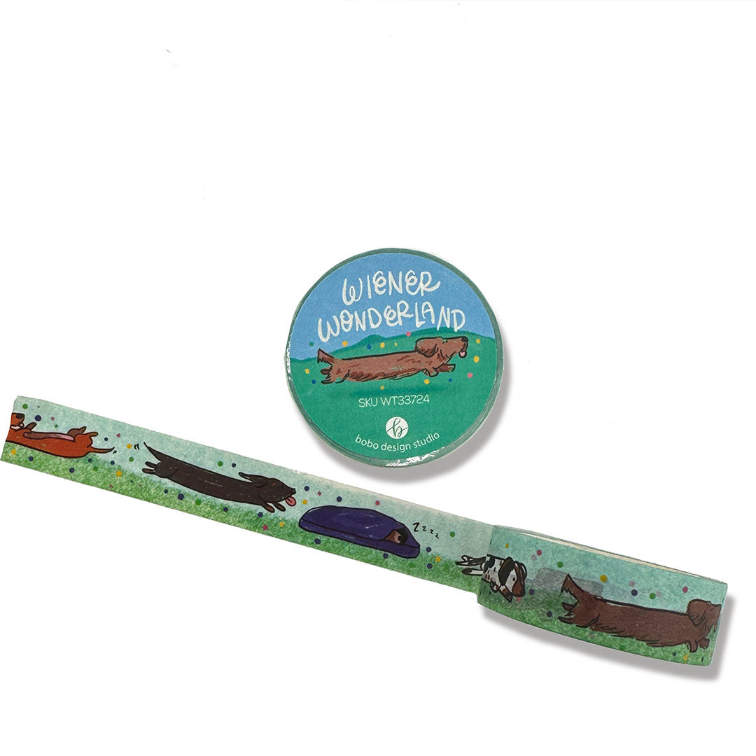 winer wonderland washi tape rolled out variety of winer dogs on green grass with a sky blue background