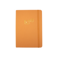 The A5 bobo Lined Journal "Tiger" with a tangerine orange linen cover. A gold foil smiling cartoon tiger head with a speech bubble with "Hi" inside, is stamped onto the center of the front cover. A corresponding orange elastic is holding the book closed.
