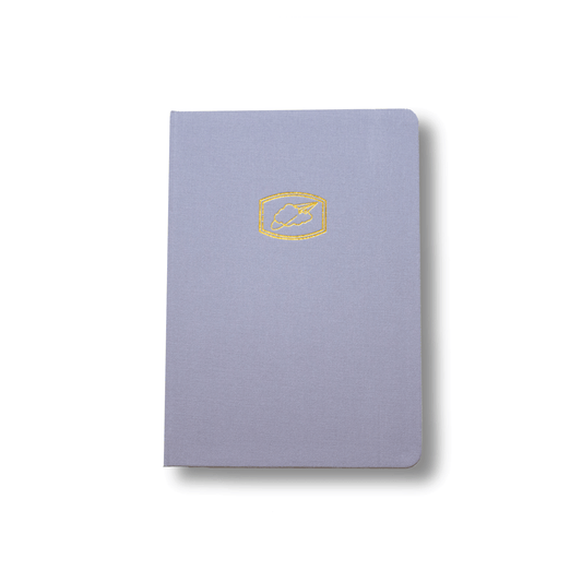 The A5 bobo BuJo dot grid journal "Cloud 9" with a light blue cover. A gold Cloud and Paper Airplane illustration is stamped on the front cover.