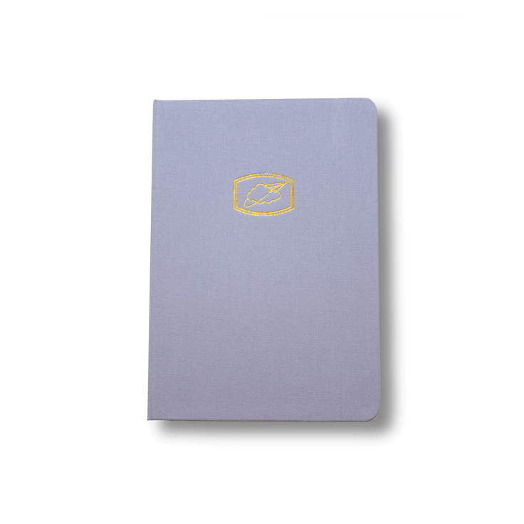 The A5 bobo BuJo dot grid journal "Cloud 9" with a light blue cover. A gold Cloud and Paper Airplane illustration is stamped on the front cover.