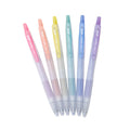 Set of six pastel-colored gel pens on a white background