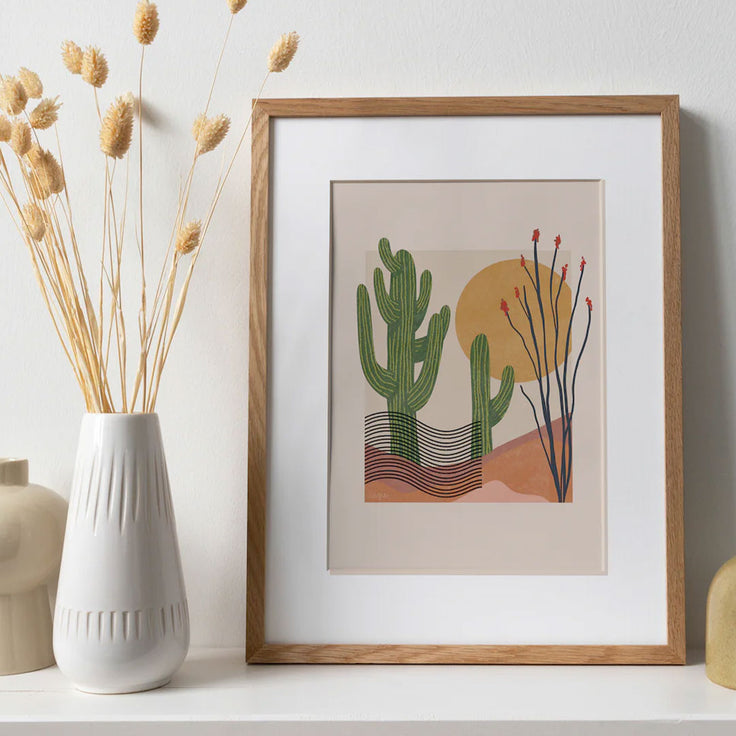 saguaro and ocotillo print with two saguaro cactus, an ocotillo plant, and a sun. with a modern art style