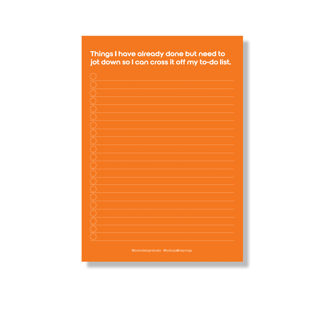 5 inch x 7 inch notepad with orange pages. "Things I have already done but need to jot down so I can cross it off my to-do list." is printed in white at the top. Below the text the page is lined for list writing, each line has a corresponding checkbox circle of the left side. A small logo at the bottom reads "@bobodesignstudio @bobopalmsprings"