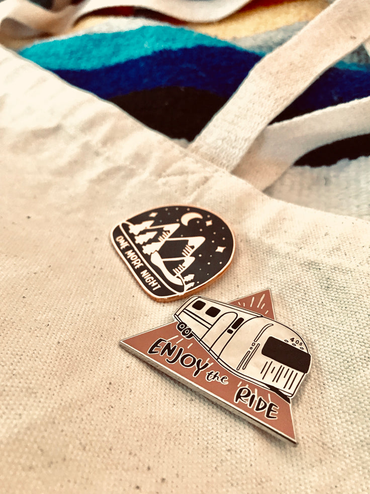 bobo design studio enamel pins. One More night enamel pin on tote bag.