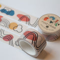 mod vibes washi tape rolled out one inch wide with abstract lines and shapes on a light beige background