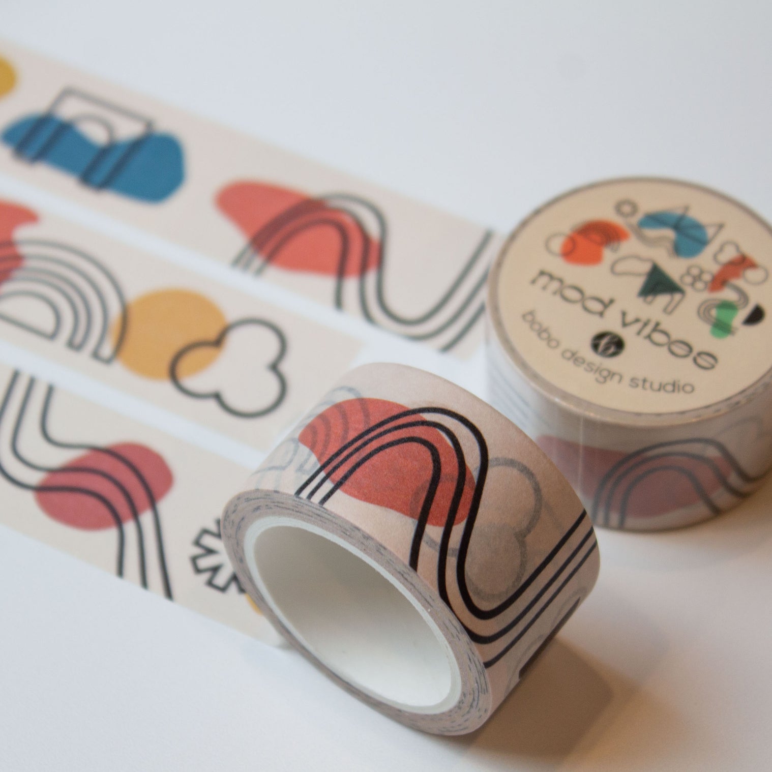 mod vibes washi tape rolled out one inch wide with abstract lines and shapes on a light beige background