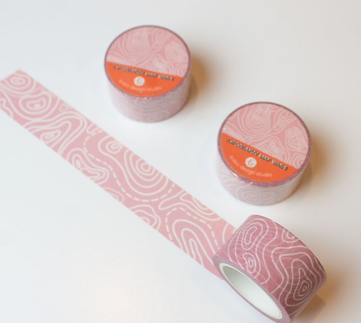 topography washi tape rolled out light pink tape with white topography lines on it