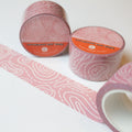topography washi tape rolled out light pink tape with white topography lines on it