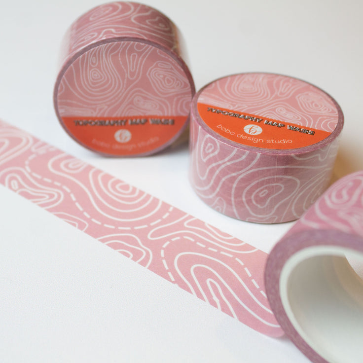 topography washi tape rolled out light pink tape with white topography lines on it