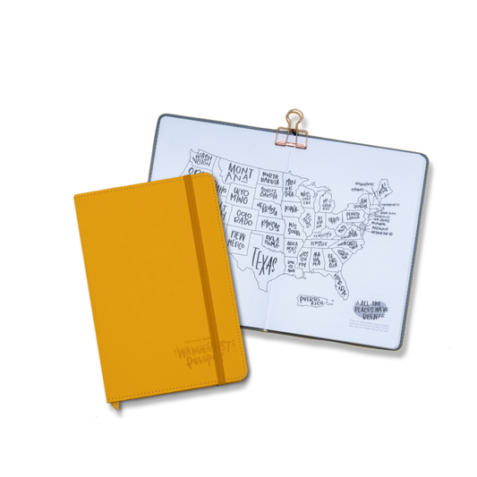 Wanderlust Passport Travel Journal in Goldenrod Yellow with an open page to the color-in US Map