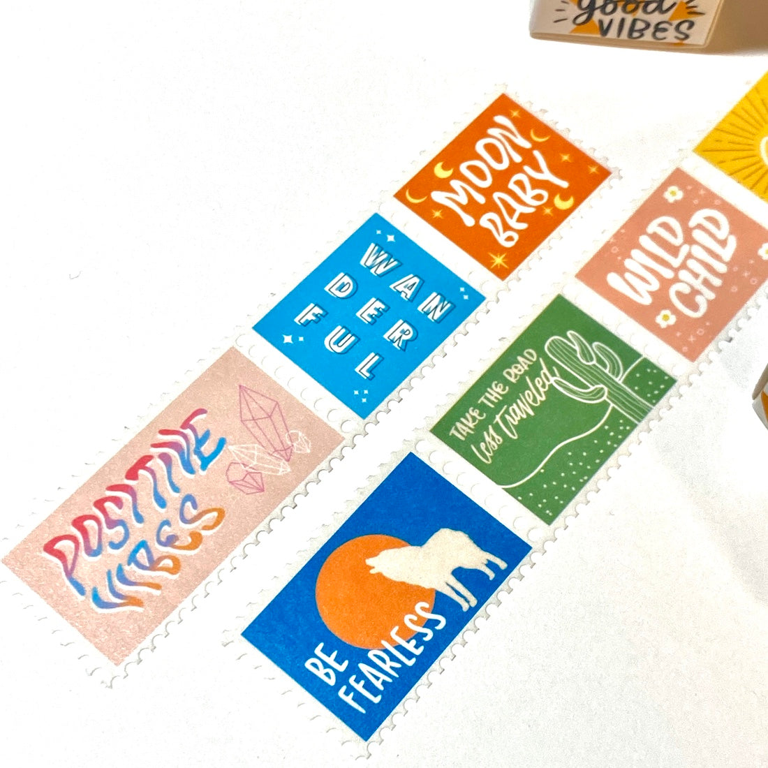 Close up of the Wild Child Postage Washi Tape with 7 groovy designs on each stamp