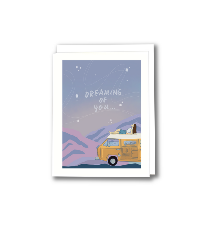 dreaming of you greeting card with a night sky with stars and a person laying on top of a van
