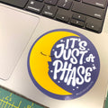 its just a phase bobo sticker with a crescent moon with a face on a laptop